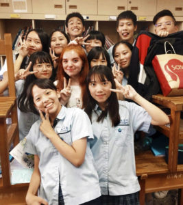 macy-taiwan Macy, surrounded by her classmates, at her school in Taipei, Taiwan