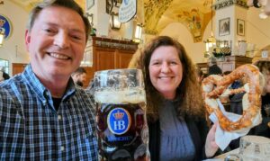 Enjoying a beer and giant pretzel at the famous Hofbräuhaus in Munich, Germany.