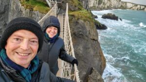Crossing the Carrick-a-Rede Rope Bridge, along the Antrim Coast in Northern Ireland.