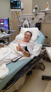 Scott in hospital after surgery to place 3 stents in his heart arteries