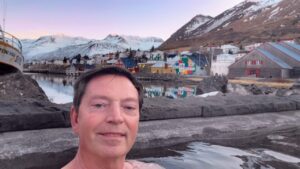 Scott relaxing in a thermal bath at sunset in Siglufjörður, Iceland.