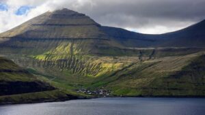 Village of Funningur, at the foot of Slættaratindur mountain, in Faroe Islands
